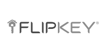Logo FlipKey, a company that offers home and apartment booking services to travelers in over 140 countries.